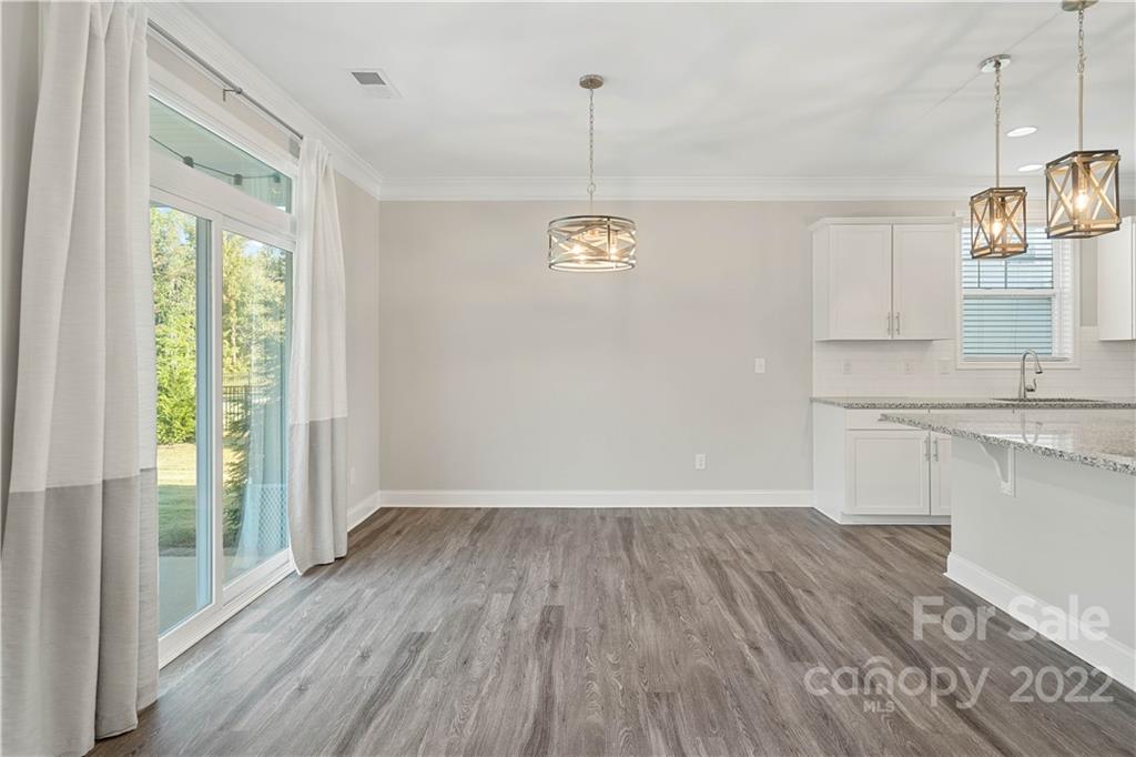 4025 Shadowbrook Road Waxhaw, NC 28173 - Photo 14 of 48 a view of empty room with wooden floor and window
