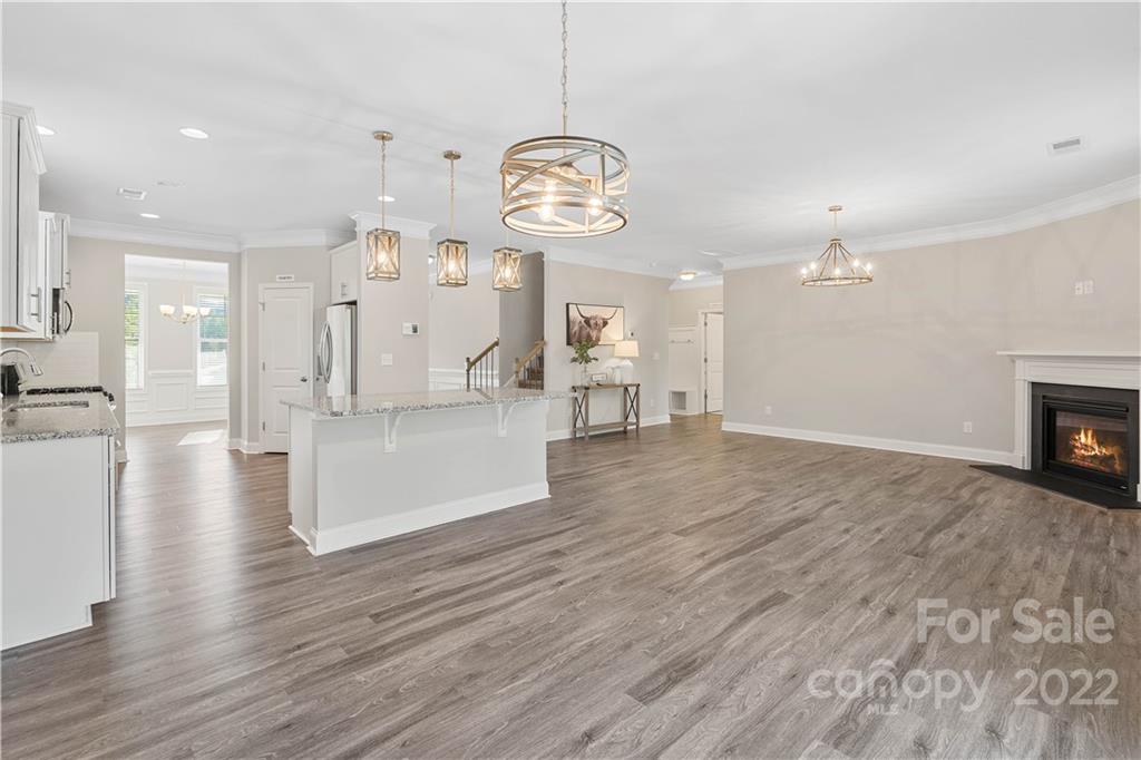 4025 Shadowbrook Road Waxhaw, NC 28173 - Photo 15 of 48 a view of a room with wooden floor fireplace and windows