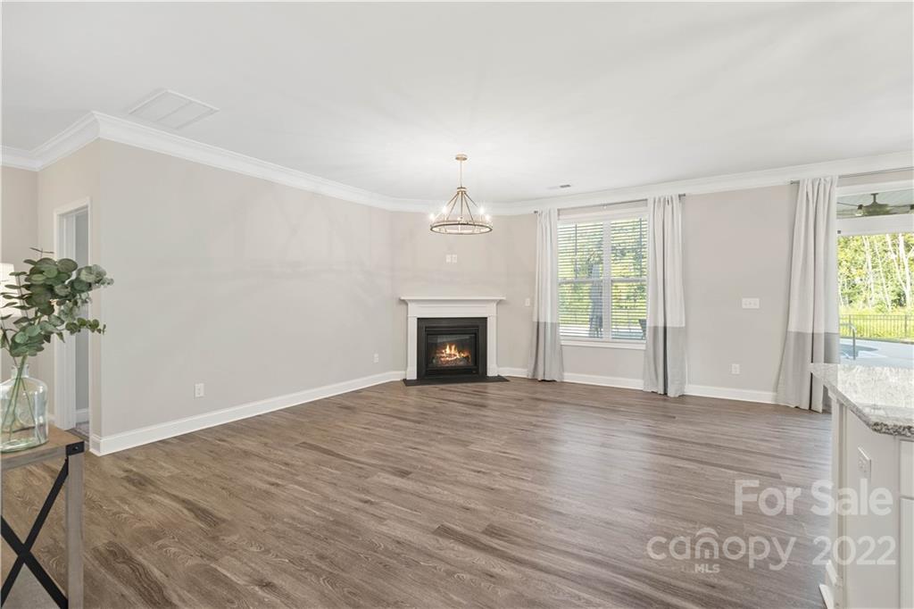 4025 Shadowbrook Road Waxhaw, NC 28173 - Photo 17 of 48 an empty room with windows and fireplace