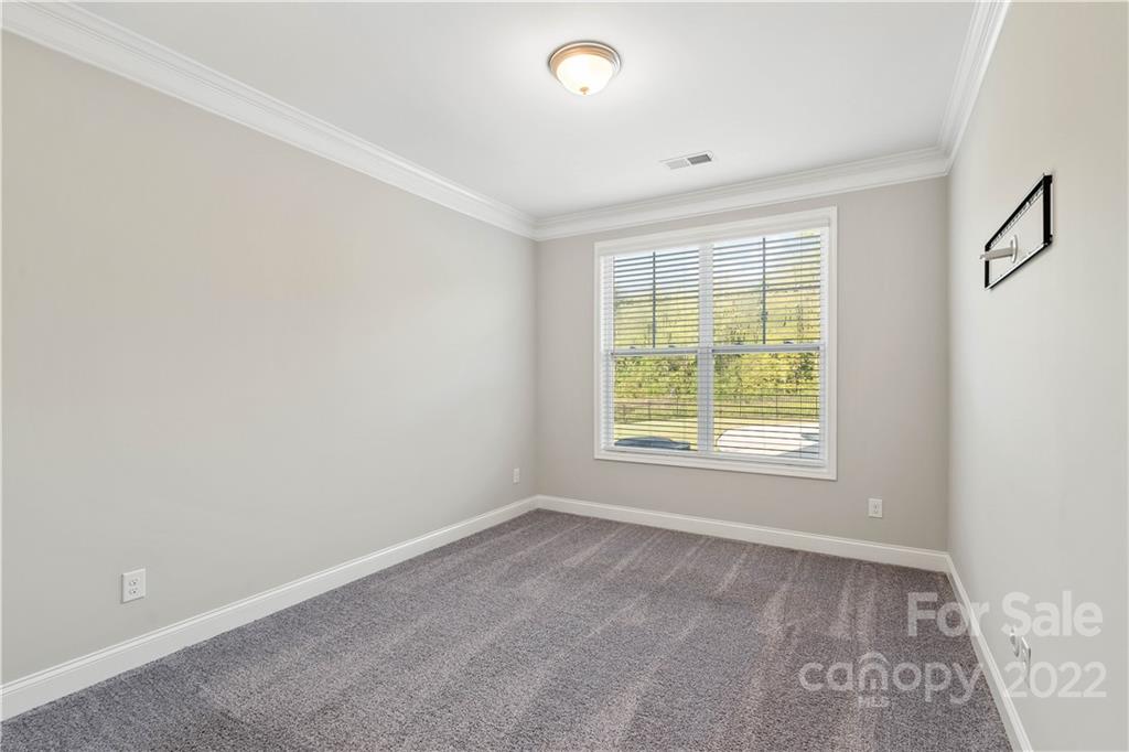 4025 Shadowbrook Road Waxhaw, NC 28173 - Photo 19 of 48 a view of an empty room with a window