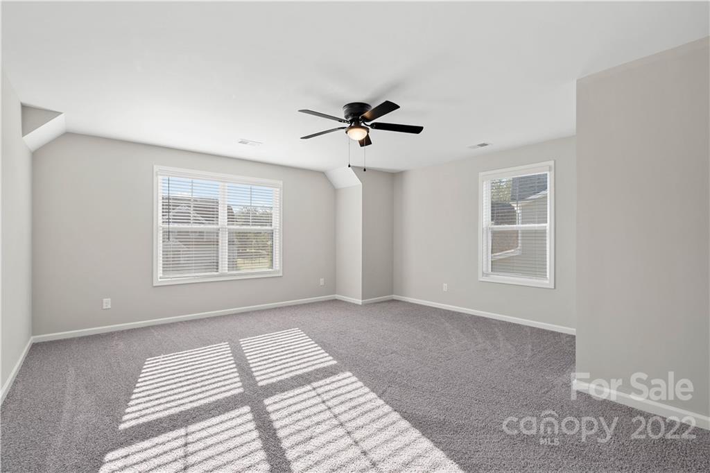 4025 Shadowbrook Road Waxhaw, NC 28173 - Photo 22 of 48 a view of a livingroom with a ceiling fan and window