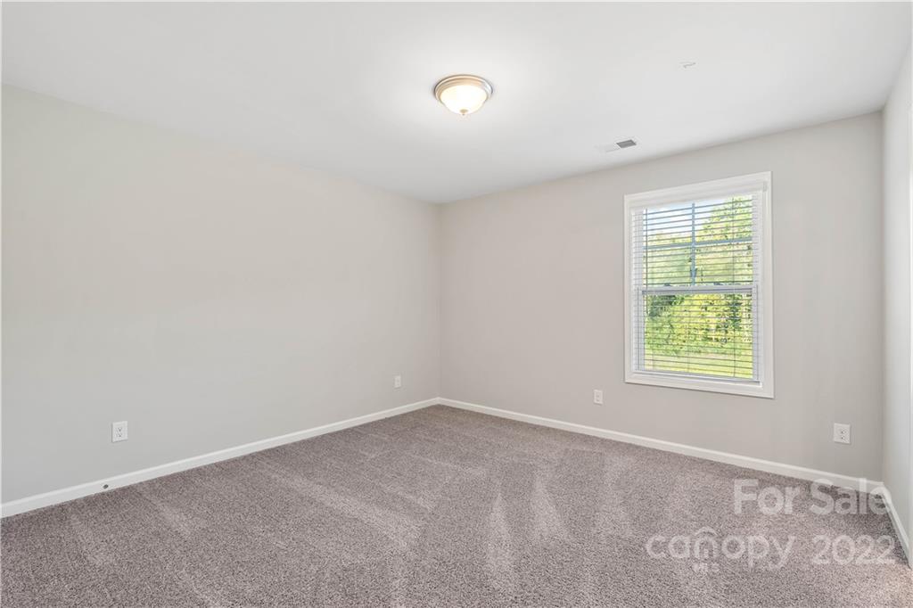 4025 Shadowbrook Road Waxhaw, NC 28173 - Photo 26 of 48 an empty room with windows