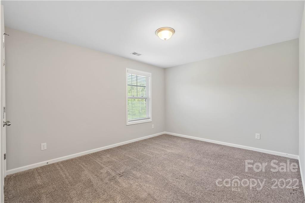 4025 Shadowbrook Road Waxhaw, NC 28173 - Photo 29 of 48 an empty room with a window
