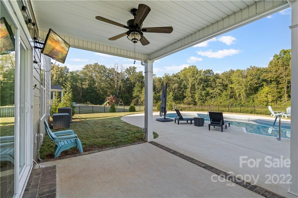 4025 Shadowbrook Road Waxhaw, NC 28173 - Photo 37 of 48 a view of a porch with furniture and a yard