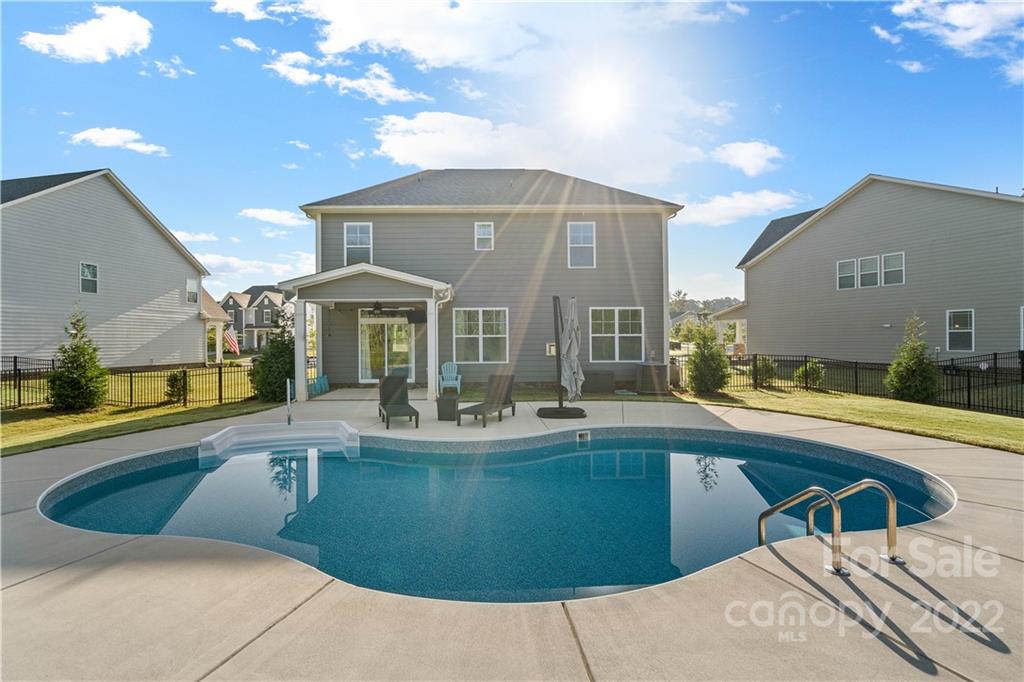 4025 Shadowbrook Road Waxhaw, NC 28173 - Photo 39 of 48 a view of a kitchen with a sink and dishwasher with wooden cabinets
