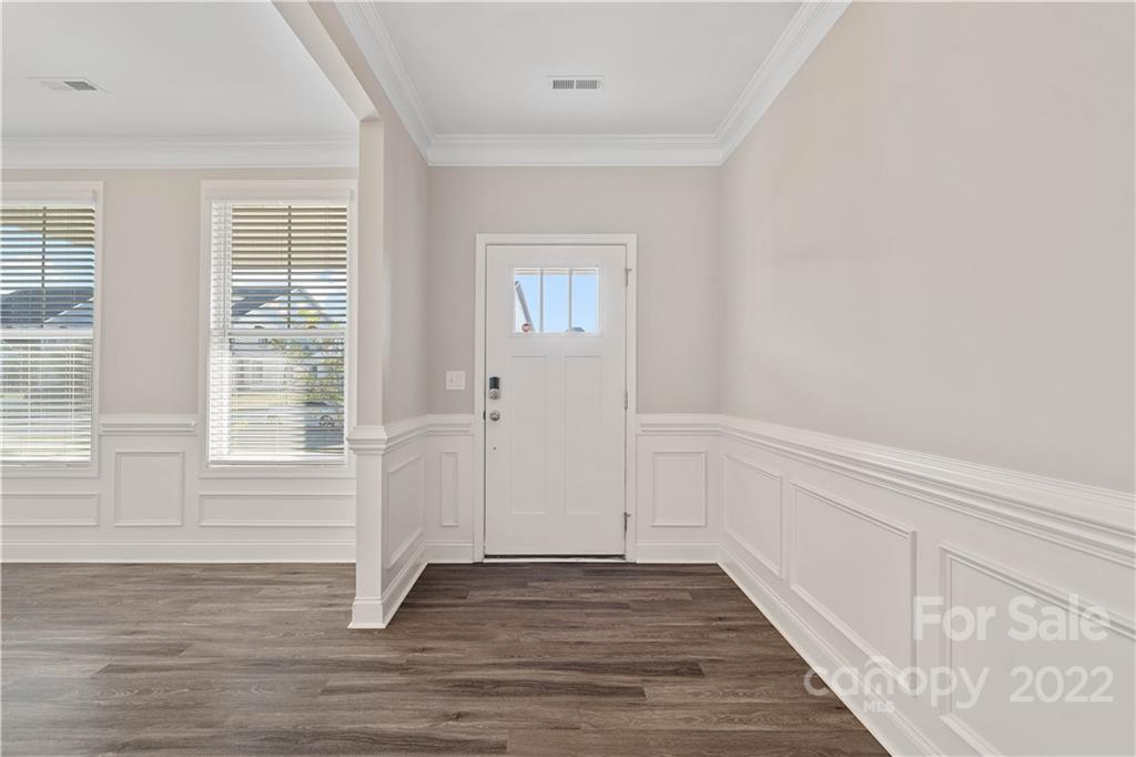 4025 Shadowbrook Road Waxhaw, NC 28173 - Photo 4 of 48 a view of empty room with wooden floor and fan
