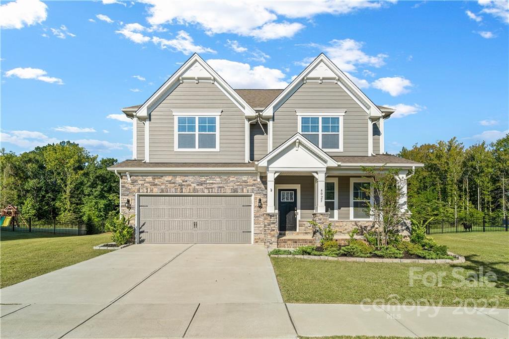 4025 Shadowbrook Road Waxhaw, NC 28173 - Photo 41 of 48 a front view of a house with a yard