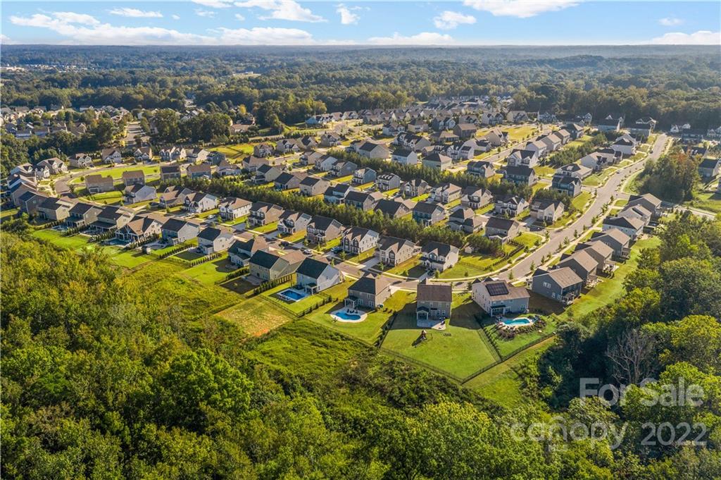 4025 Shadowbrook Road Waxhaw, NC 28173 - Photo 48 of 48 an aerial view of residential houses with outdoor space and trees