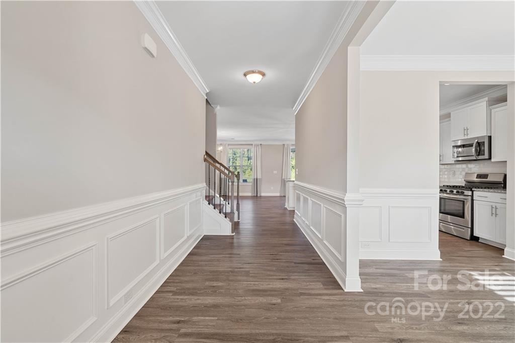 4025 Shadowbrook Road Waxhaw, NC 28173 - Photo 5 of 48 a view of a hallway with wooden floor