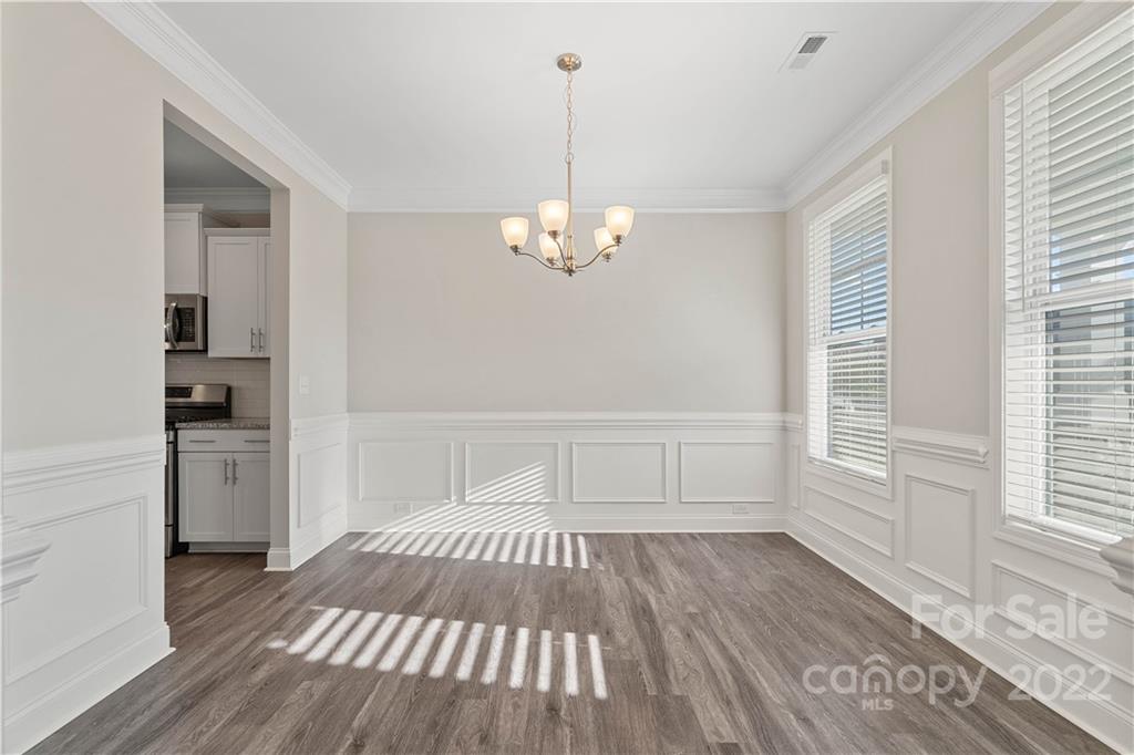 4025 Shadowbrook Road Waxhaw, NC 28173 - Photo 6 of 48 a view of a room with wooden floor cabinets and a window