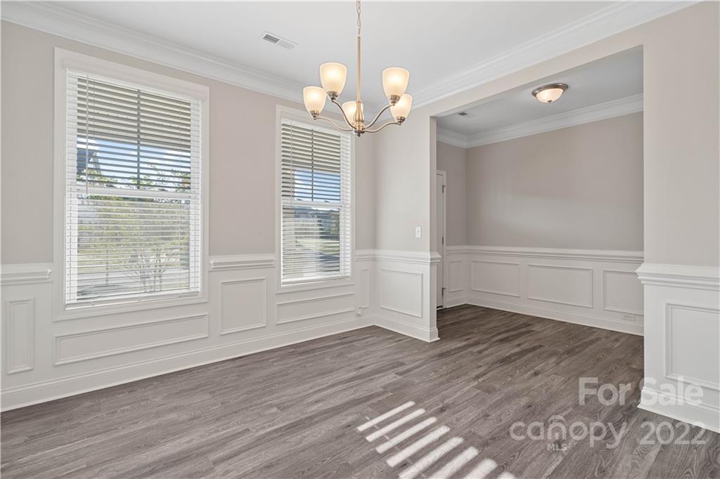 4025 Shadowbrook Road Waxhaw, NC 28173 - Photo 7 of 48 wooden floor in an empty room with a window