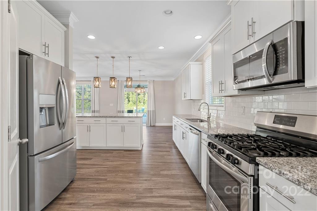 4025 Shadowbrook Road Waxhaw, NC 28173 - Photo 8 of 48 a kitchen with stainless steel appliances a refrigerator sink and microwave
