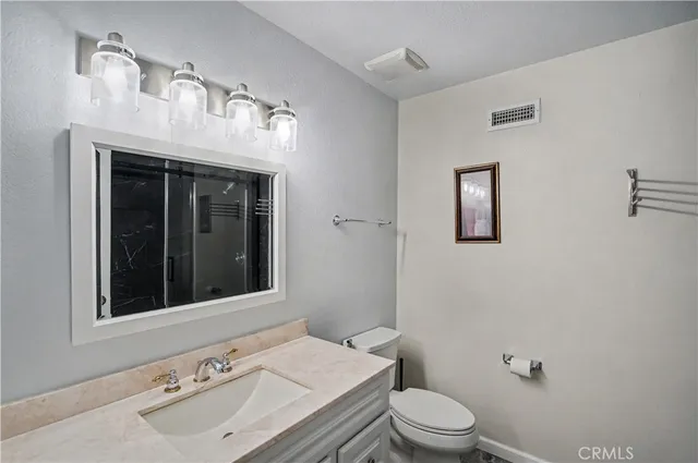 a bathroom with a sink and a toilet