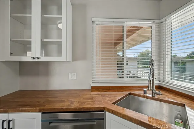 a kitchen with a sink and a window