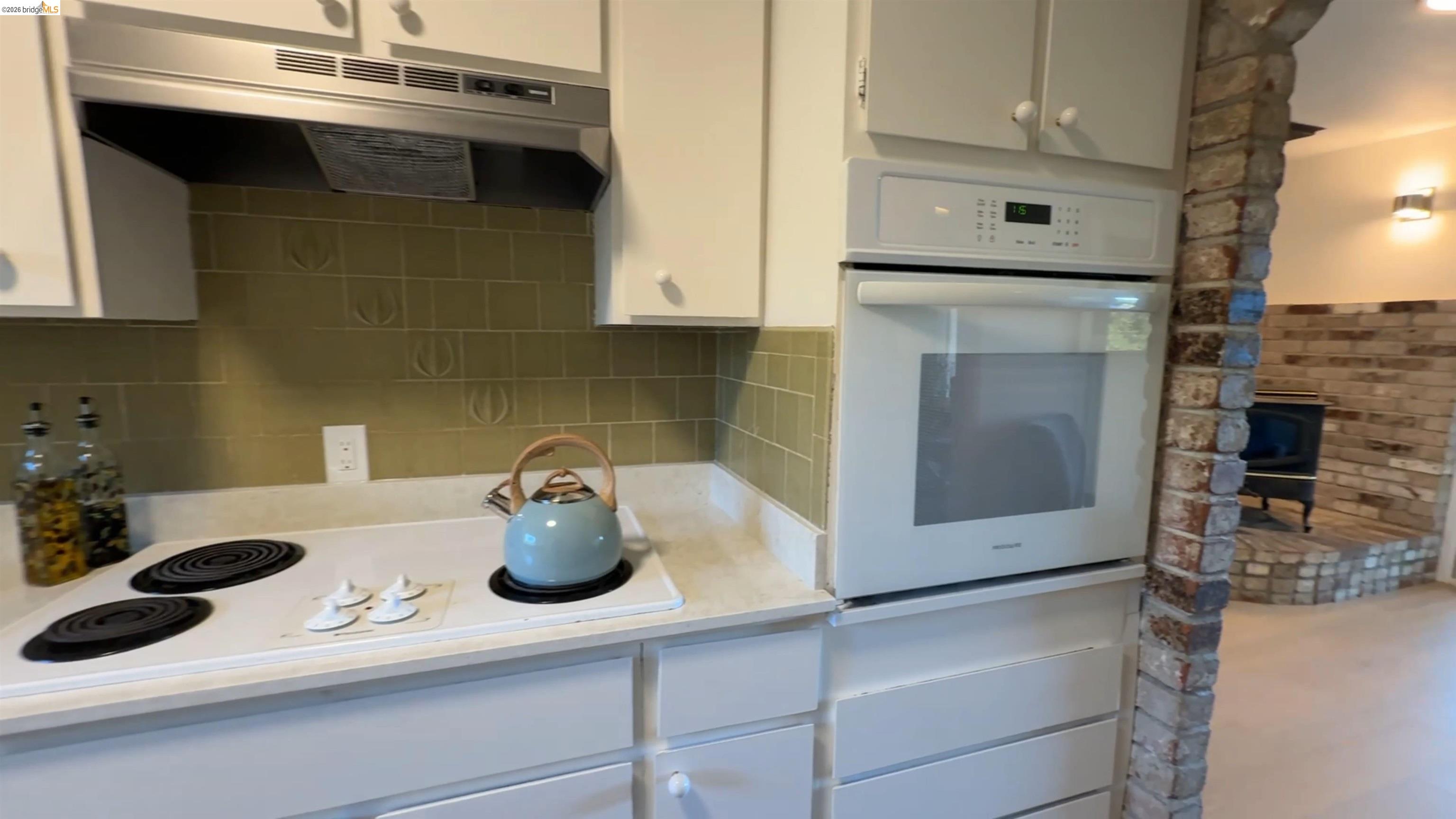 5051 Harrison Grade Road Sebastopol, CA 95472 - Photo 12 of 31 a kitchen with a sink and a stove top oven
