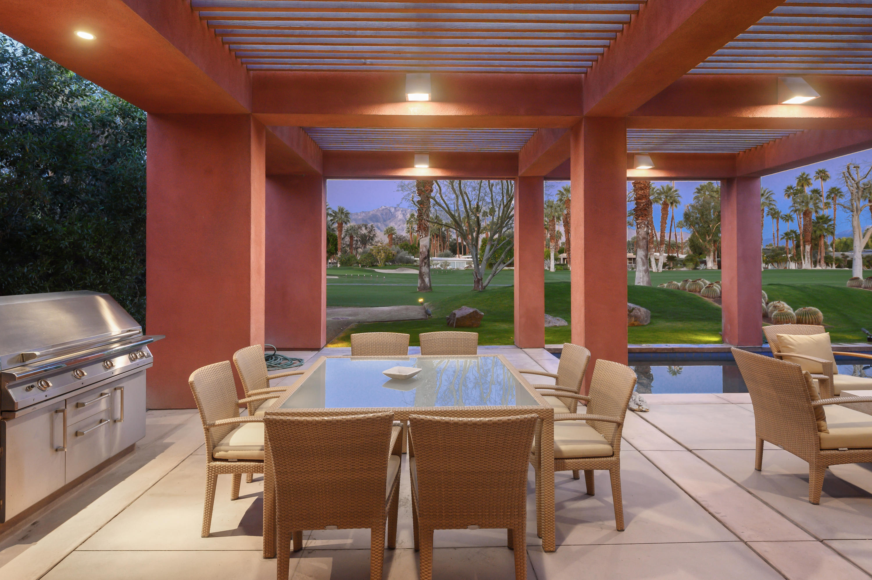 37801 Thompson Road Rancho Mirage, CA 92270 - Photo 13 of 31 a dining room with furniture a chandelier and outdoor view