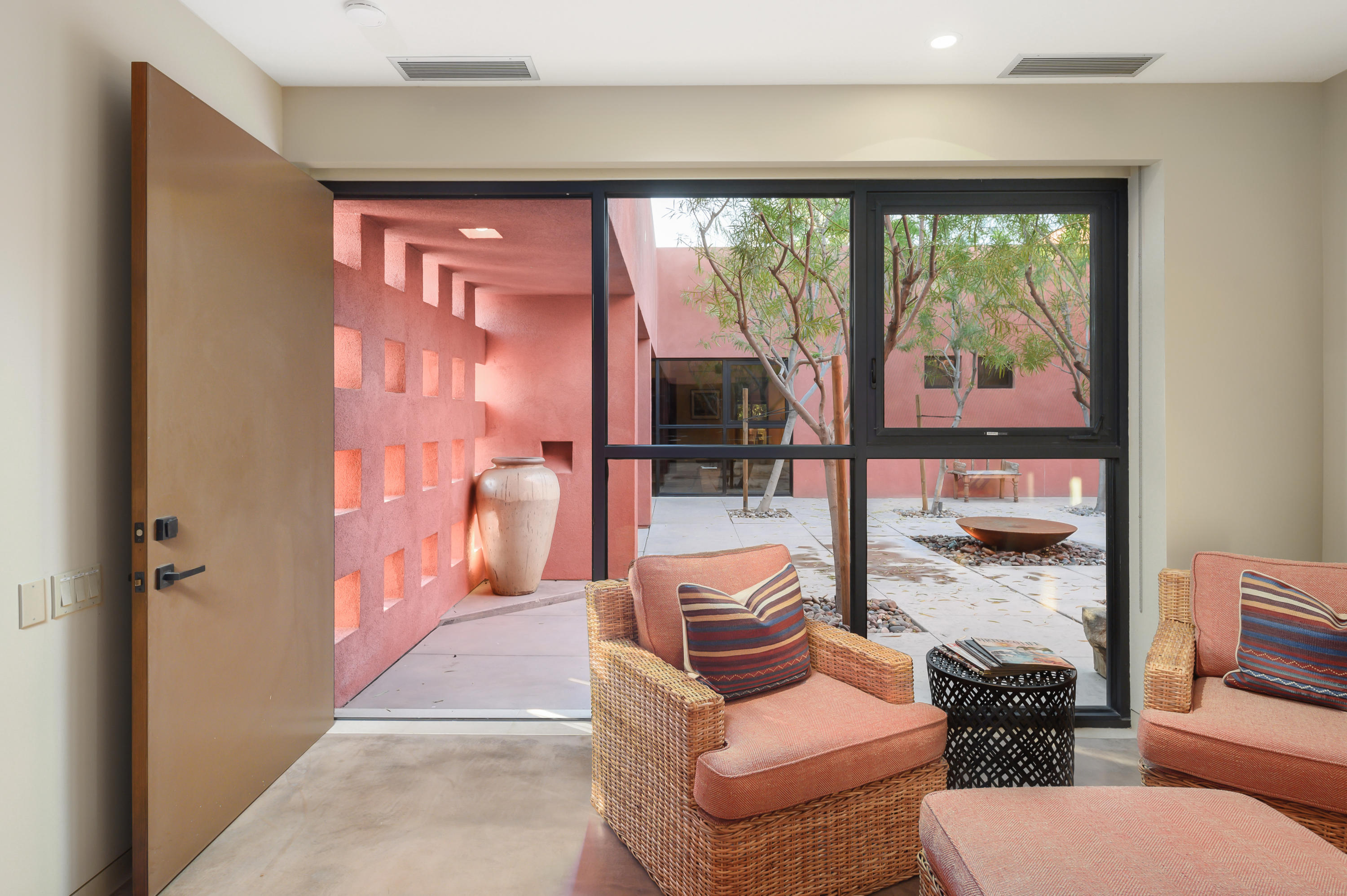37801 Thompson Road Rancho Mirage, CA 92270 - Photo 31 of 31 a living room with furniture and a floor to ceiling window
