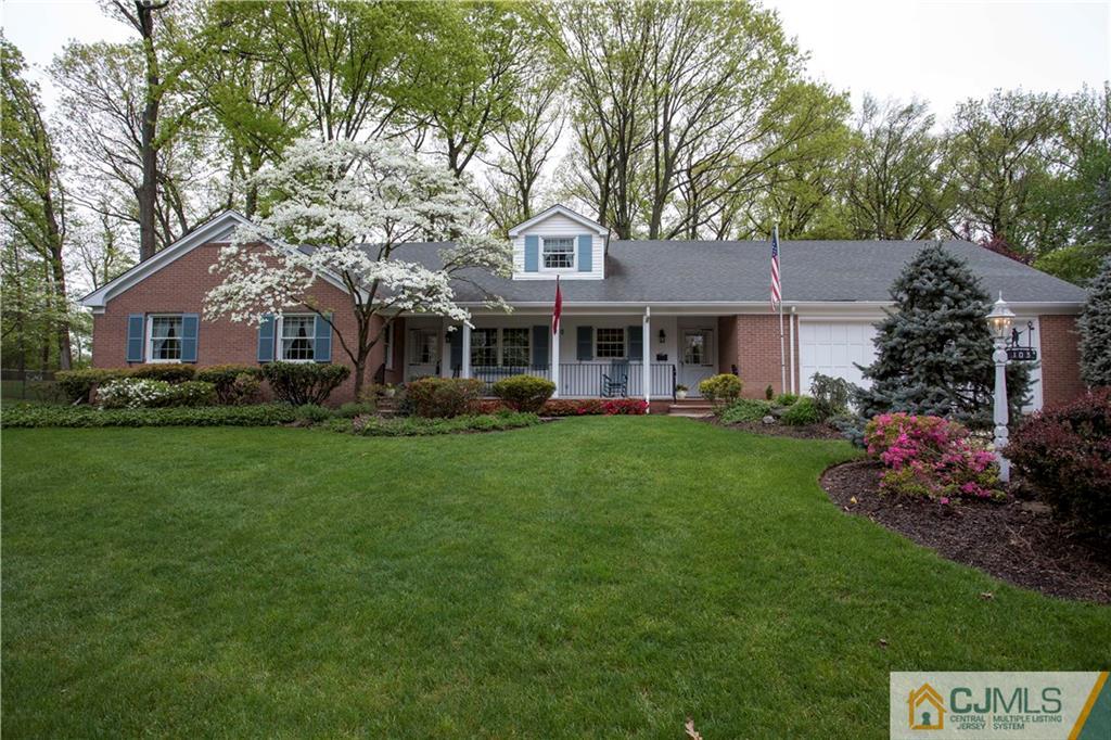 103 Buchanan Road Edison, NJ 08820 - Photo 1 of 25 a front view of a house with a garden and trees
