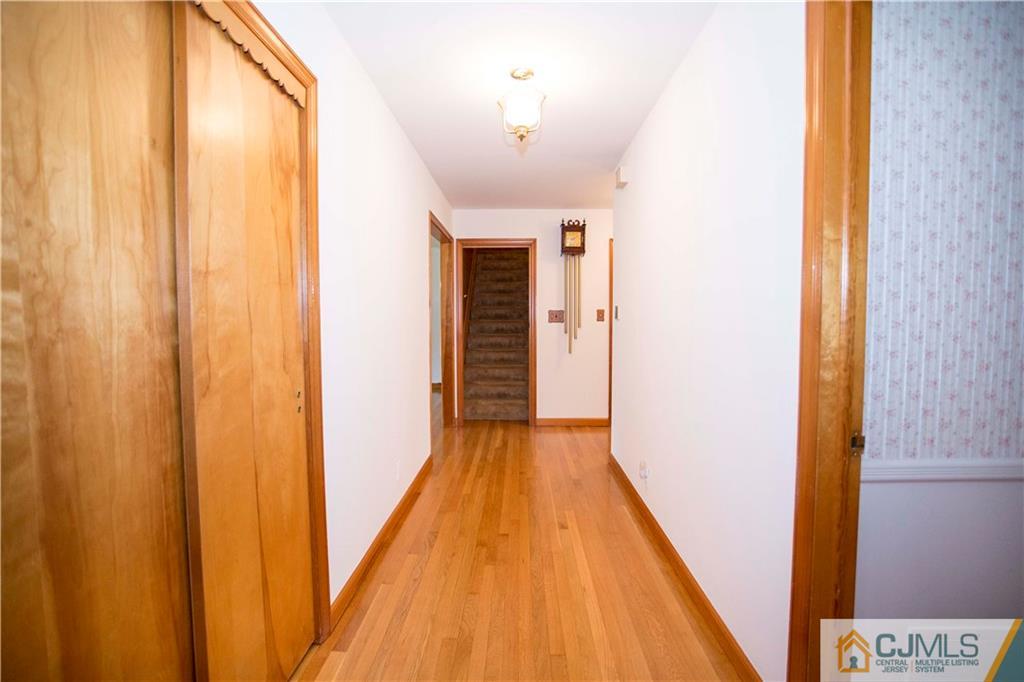 103 Buchanan Road Edison, NJ 08820 - Photo 17 of 25 a view of a hallway with wooden floor