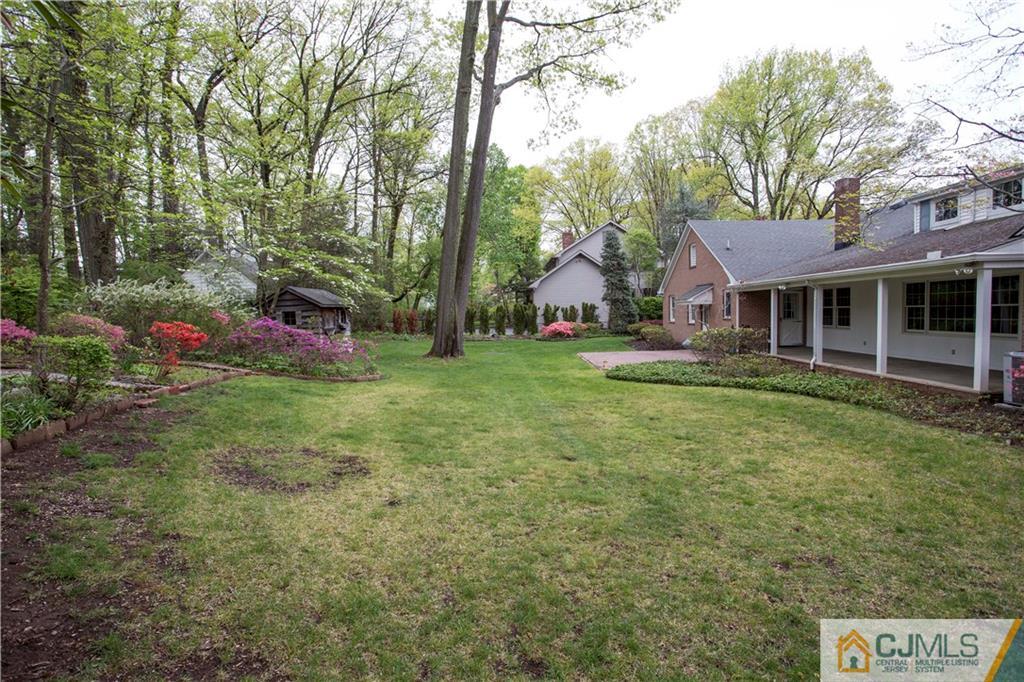 103 Buchanan Road Edison, NJ 08820 - Photo 3 of 25 a view of a house with a yard and sitting area