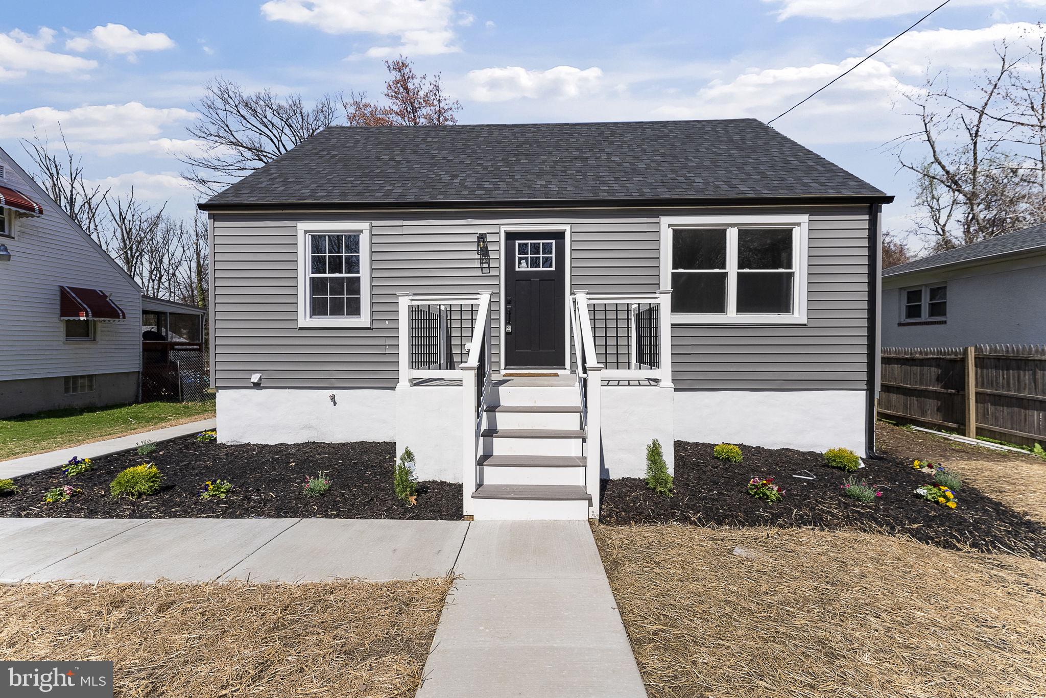 8310 Karl Avenue Rosedale, MD 21237 - Photo 1 of 39 a front view of a house with a yard