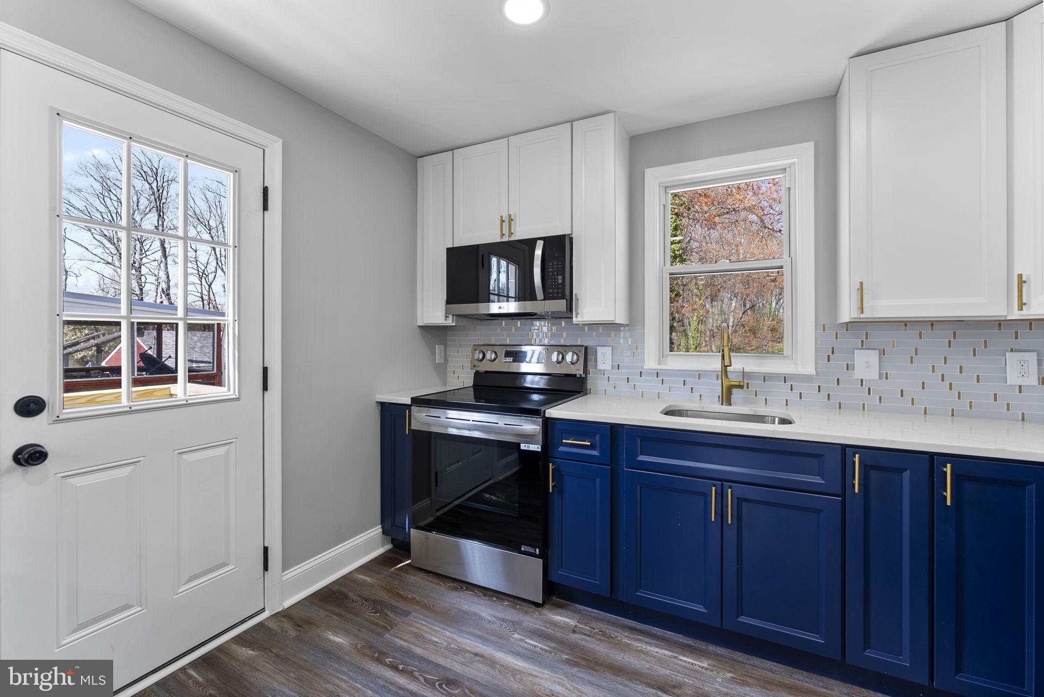 8310 Karl Avenue Rosedale, MD 21237 - Photo 12 of 39 a kitchen with a sink stove and cabinets