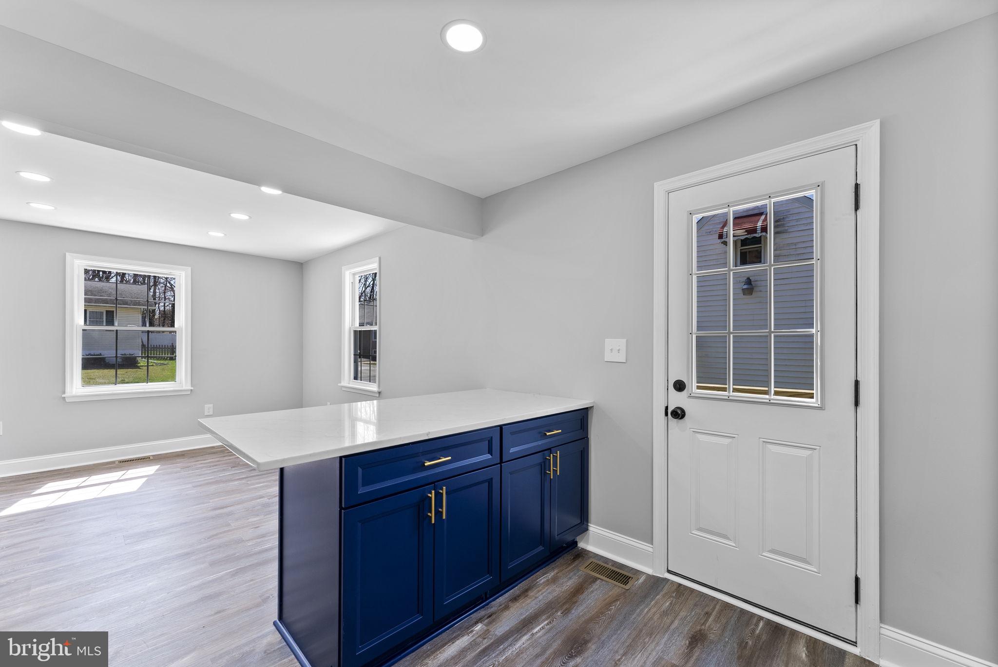 8310 Karl Avenue Rosedale, MD 21237 - Photo 16 of 39 a kitchen with a sink and wooden cabinets