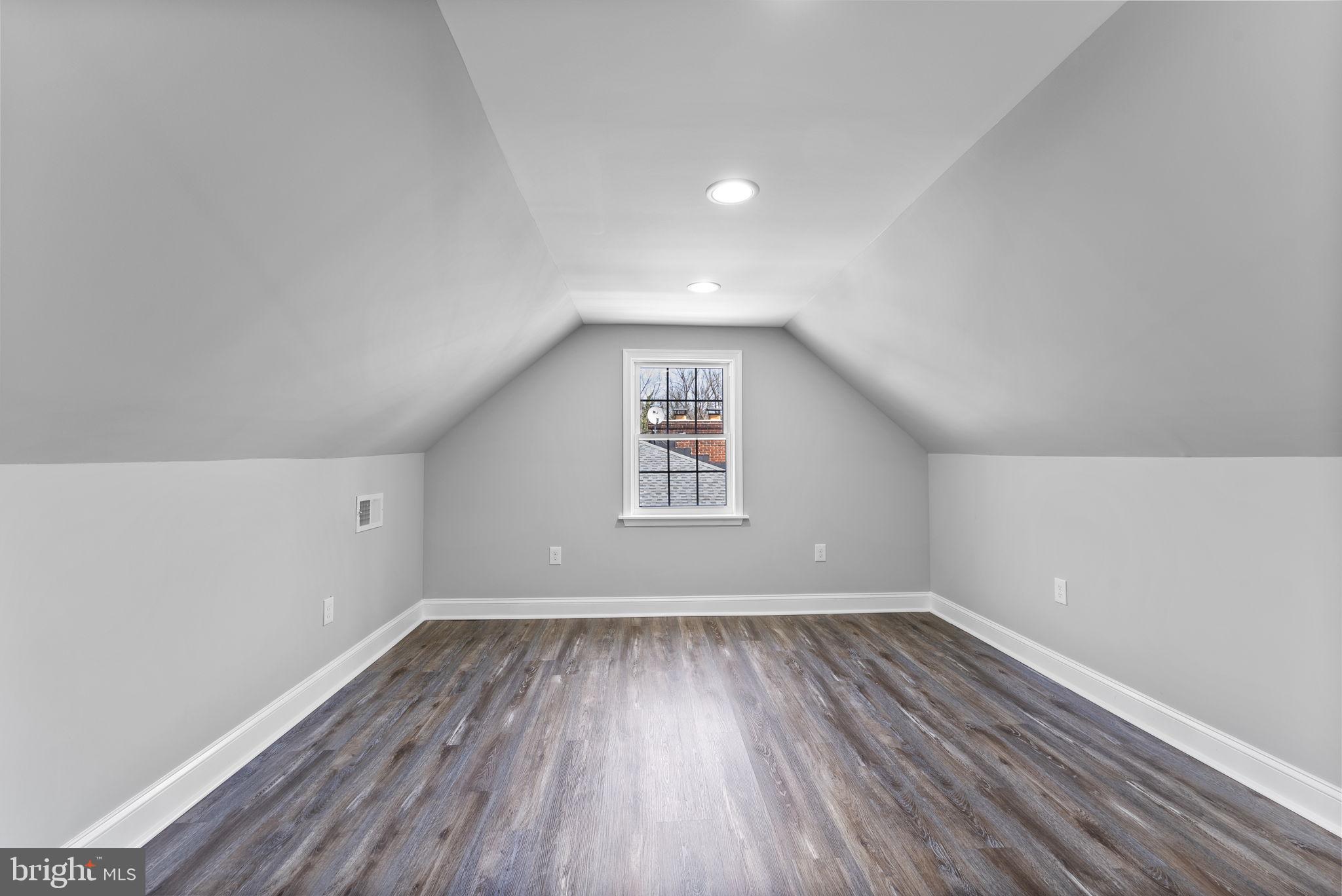 8310 Karl Avenue Rosedale, MD 21237 - Photo 26 of 39 wooden floor in an empty room with a window