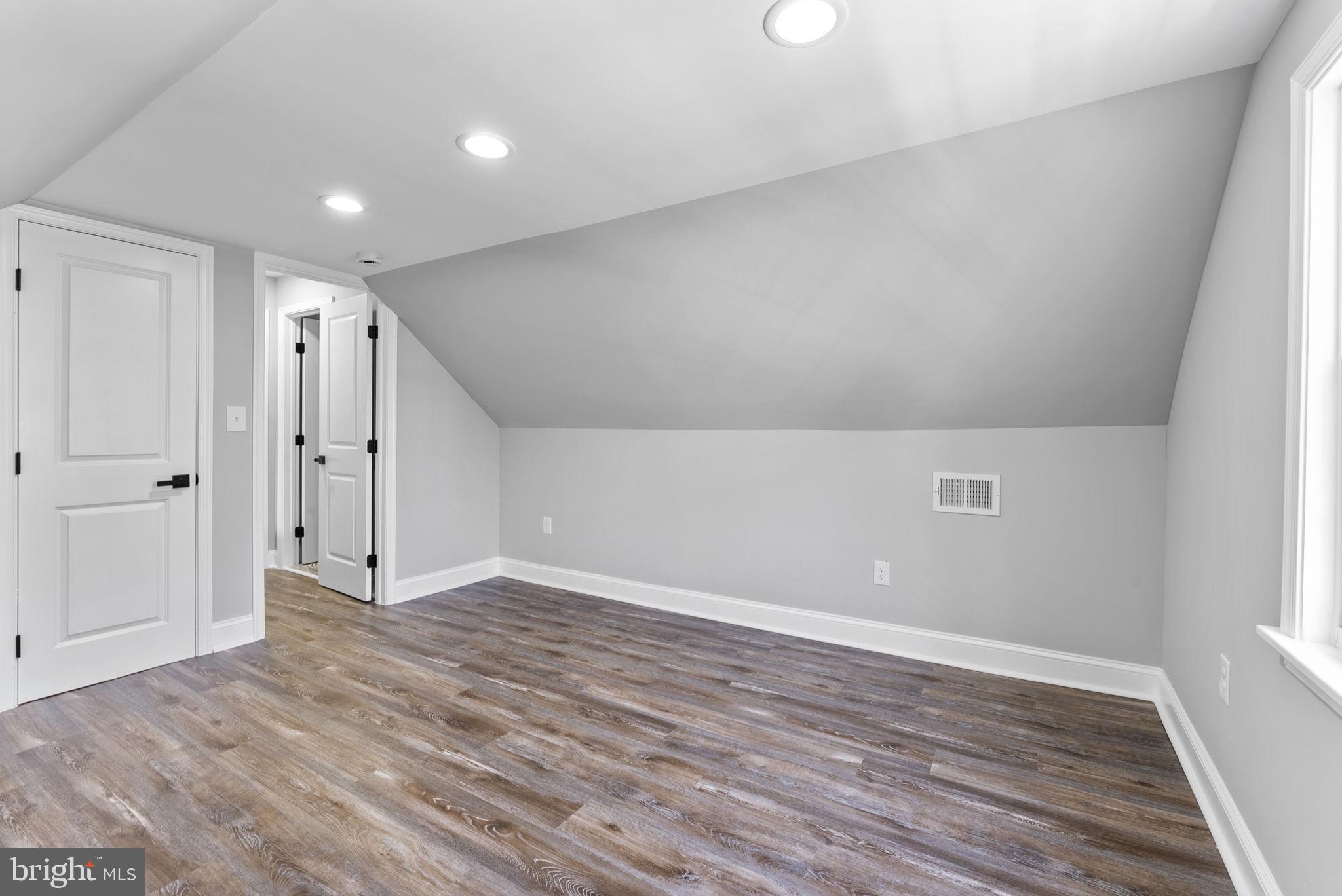 8310 Karl Avenue Rosedale, MD 21237 - Photo 27 of 39 wooden floor in an empty room with a window