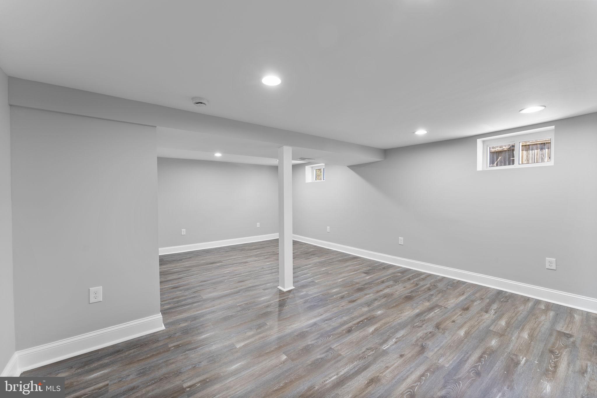 8310 Karl Avenue Rosedale, MD 21237 - Photo 29 of 39 a view of an empty room with wooden floor
