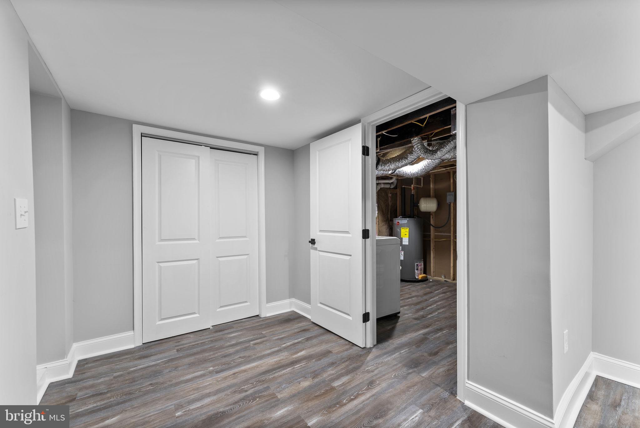 8310 Karl Avenue Rosedale, MD 21237 - Photo 32 of 39 a view of a hallway with wooden floor