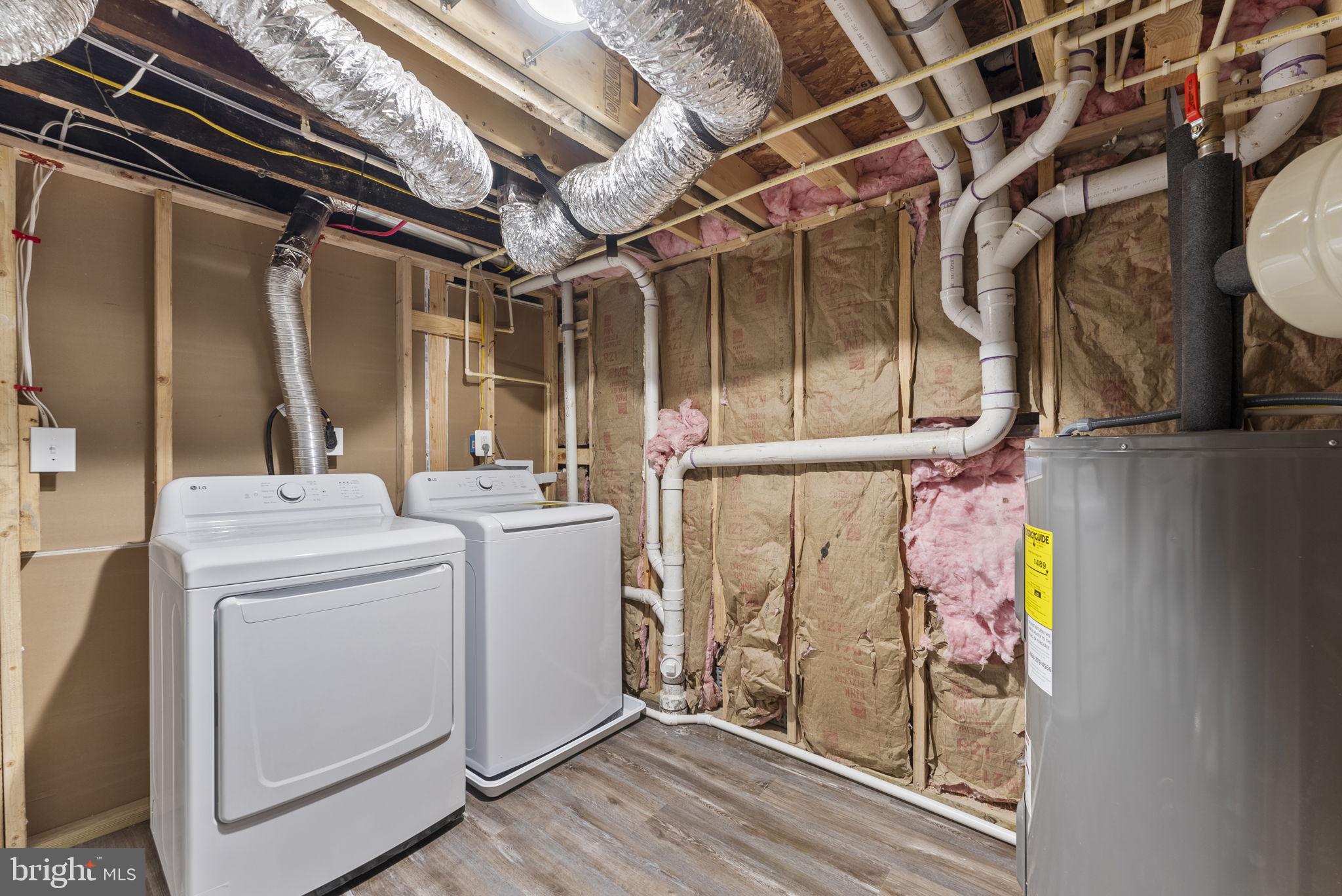 8310 Karl Avenue Rosedale, MD 21237 - Photo 33 of 39 a view of storage and utility room with washer and dryer
