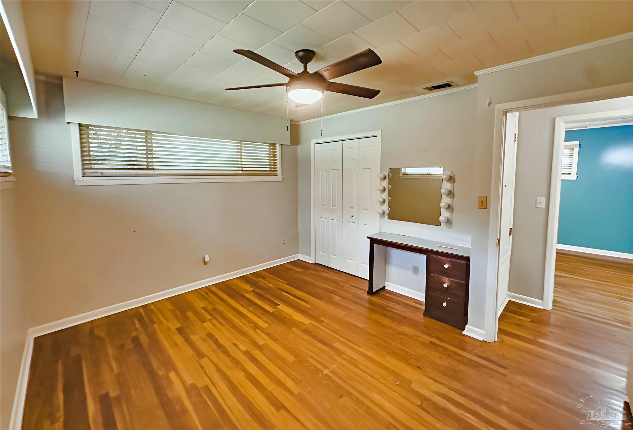 3224 Highway 4 Jay, FL 32565 - Photo 12 of 25 a bedroom with a bed and wooden floor