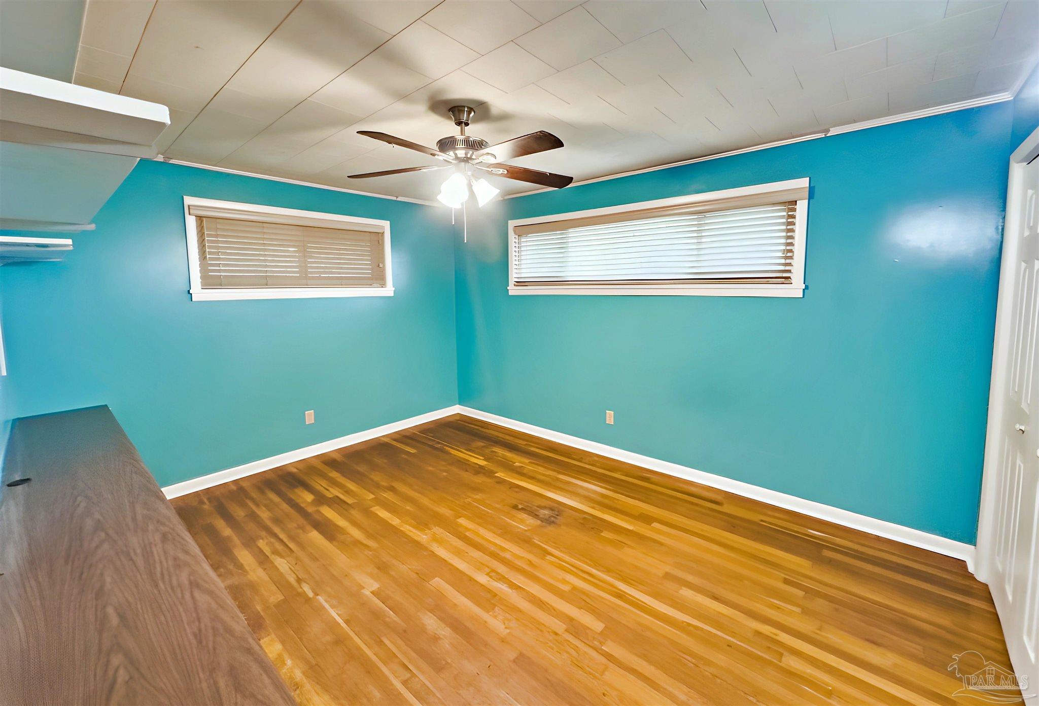 3224 Highway 4 Jay, FL 32565 - Photo 13 of 25 a view of a room with a ceiling fan and wooden floor
