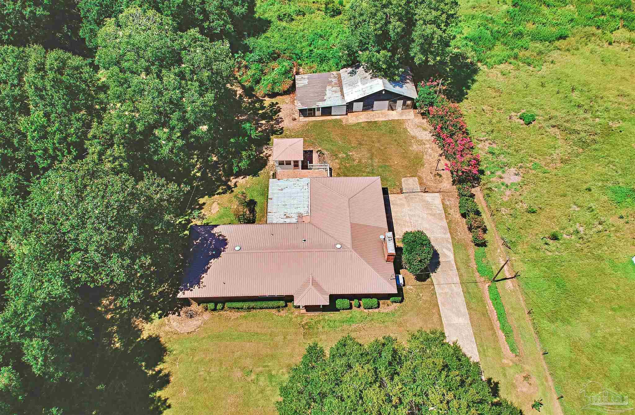 3224 Highway 4 Jay, FL 32565 - Photo 4 of 25 an aerial view of a house with swimming pool and garden