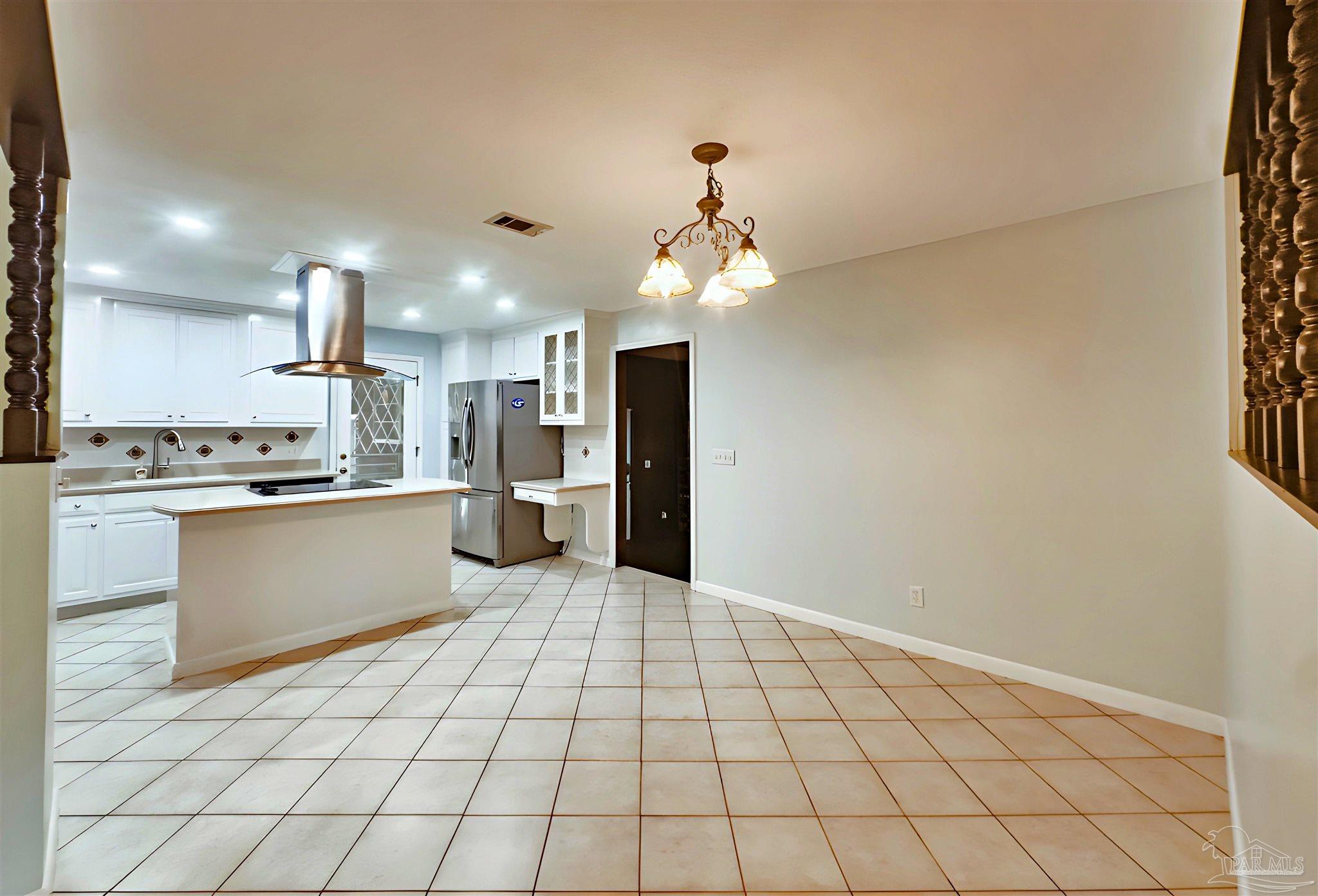 3224 Highway 4 Jay, FL 32565 - Photo 8 of 25 a large white kitchen with a stove a sink dishwasher and a refrigerator with wooden floor