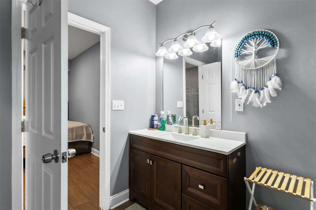 1740 Gratis Road Monroe, GA 30656 - Photo 14 of 26 a bathroom with a sink and a mirror