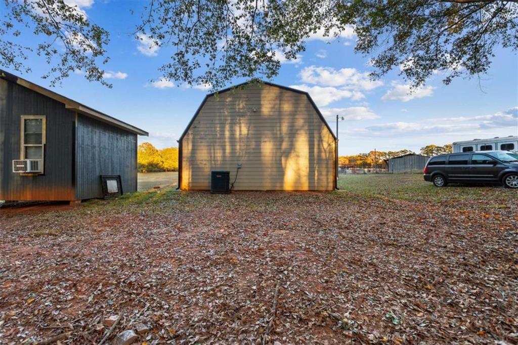 1740 Gratis Road Monroe, GA 30656 - Photo 6 of 26 a view of a house with a yard