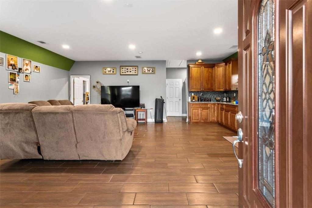 1740 Gratis Road Monroe, GA 30656 - Photo 7 of 26 a living room with furniture and a flat screen tv