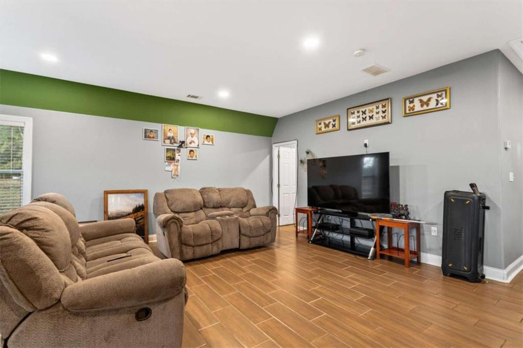 1740 Gratis Road Monroe, GA 30656 - Photo 8 of 26 a living room with furniture and a flat screen tv