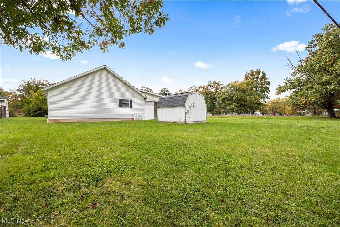 4341 Laurel Road Lorain, OH 44055 - Photo 26 of 36 View of yard with a storage unit