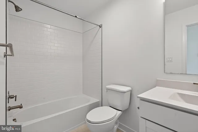 a bathroom with a sink a toilet and a bathtub