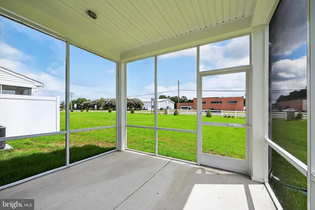 a view of a back yard from a room