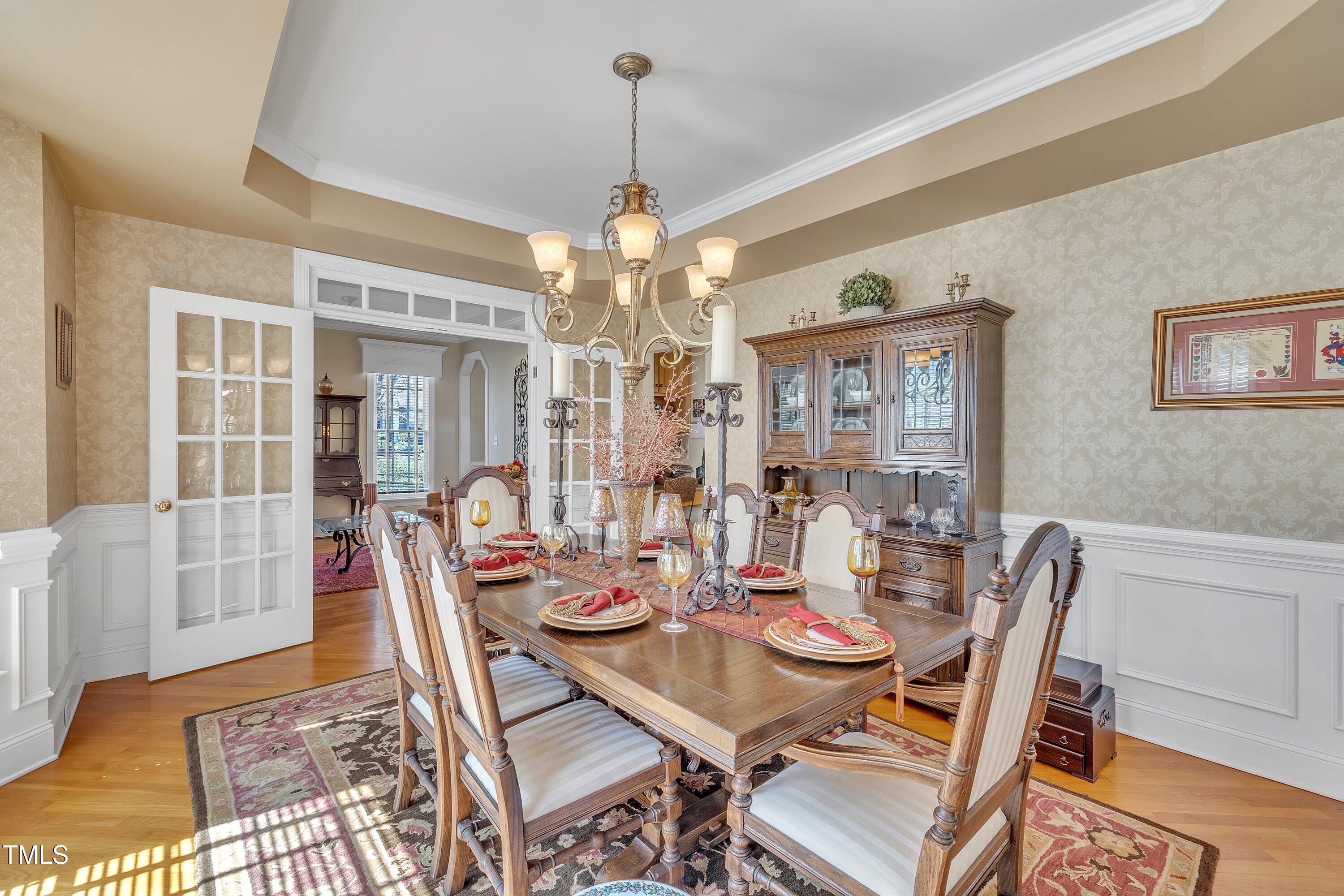 12504 Ribbongrass Court Raleigh, NC 27614 - Photo 10 of 51 Exquisite dining room w/French Doors, trey ceiling, bay window, wainscoting and crown molding!