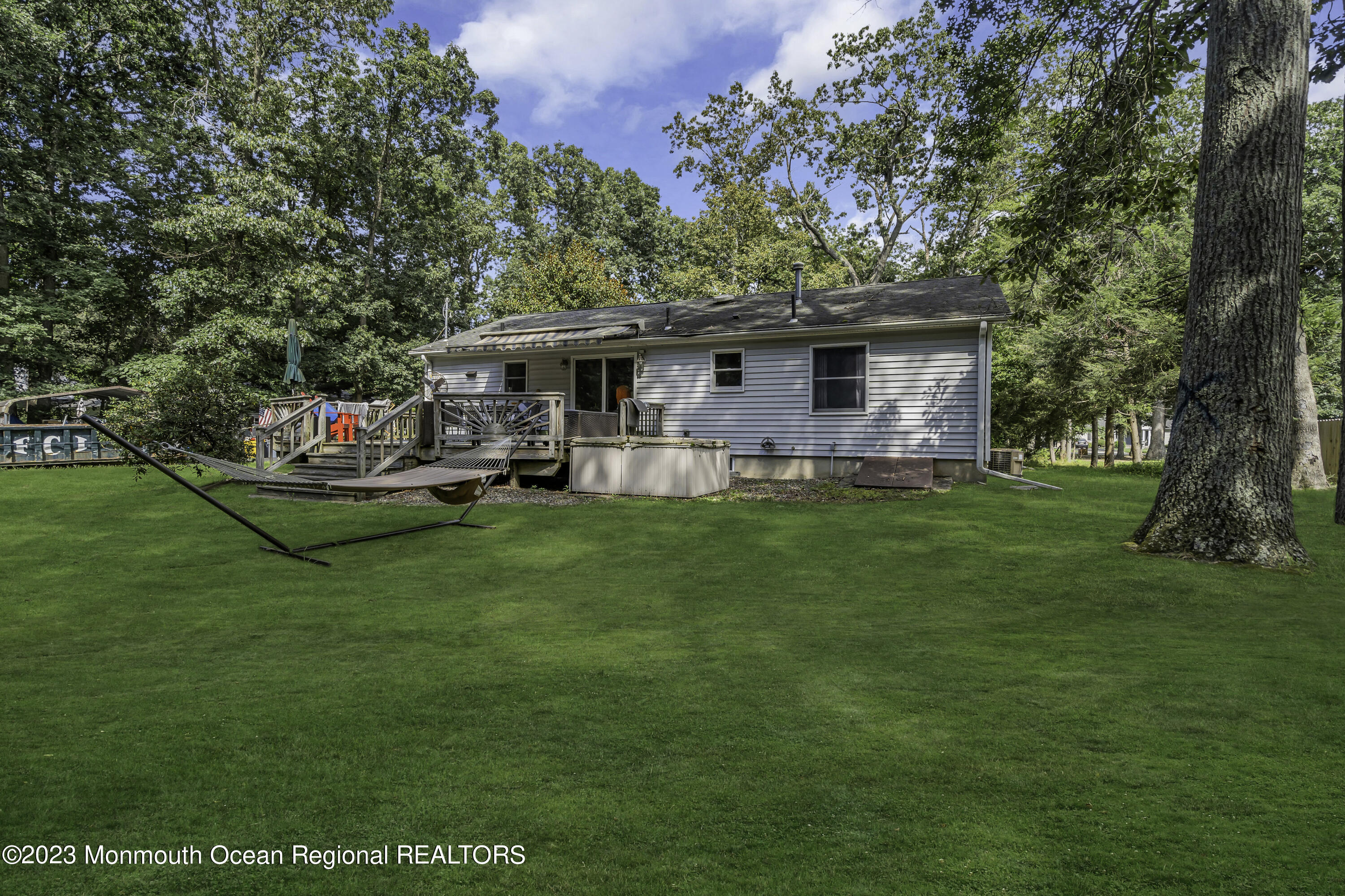 26 Frank Applegate Road Jackson, NJ 08527 - Photo 11 of 16 a front view of a house with swing and a tree