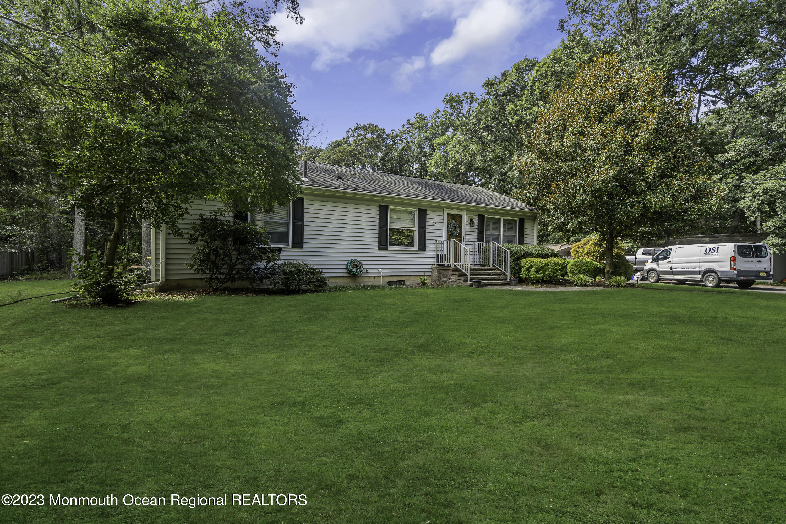 26 Frank Applegate Road Jackson, NJ 08527 - Photo 14 of 16 a front view of house with a garden and trees