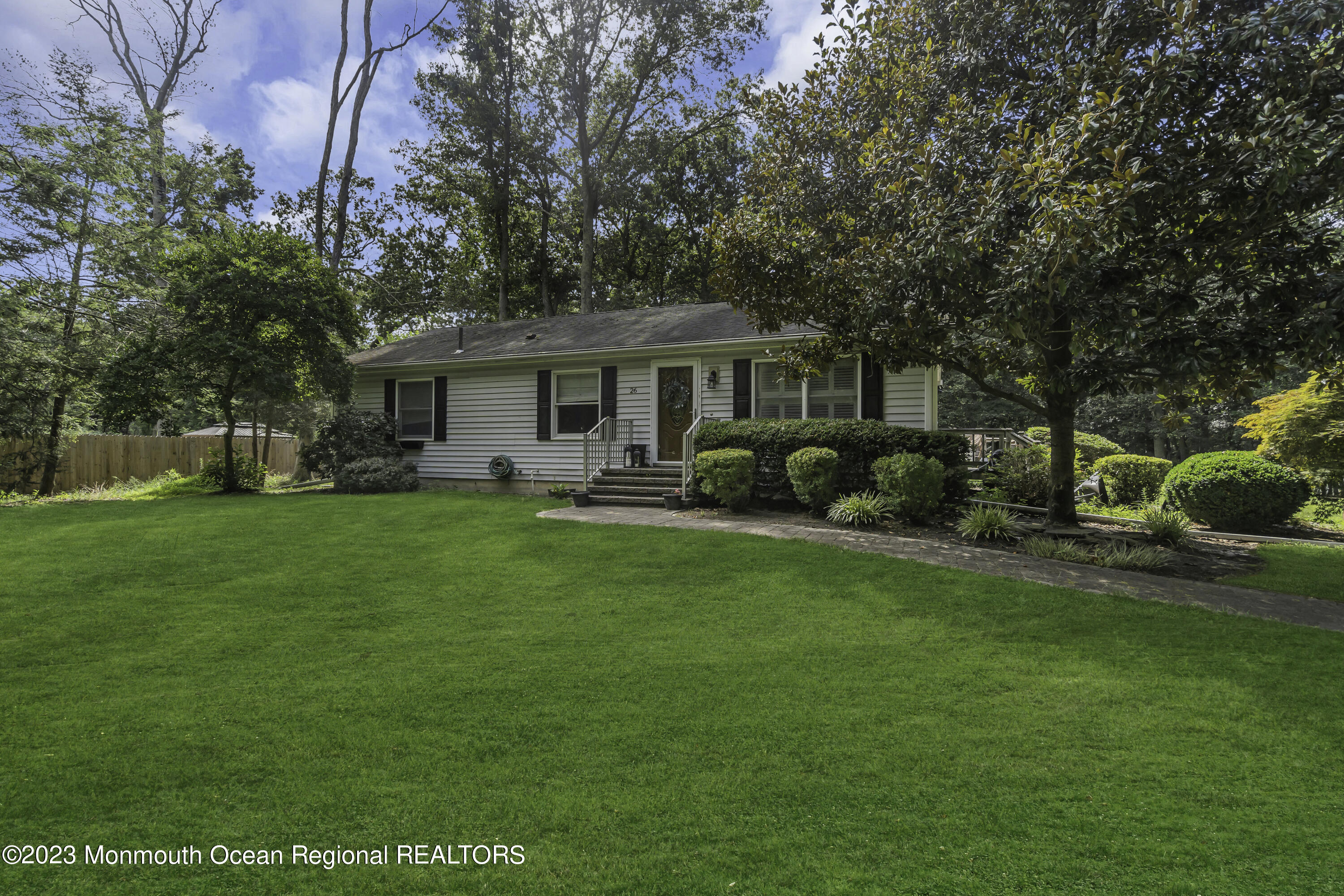 26 Frank Applegate Road Jackson, NJ 08527 - Photo 2 of 16 a front view of house with yard and green space