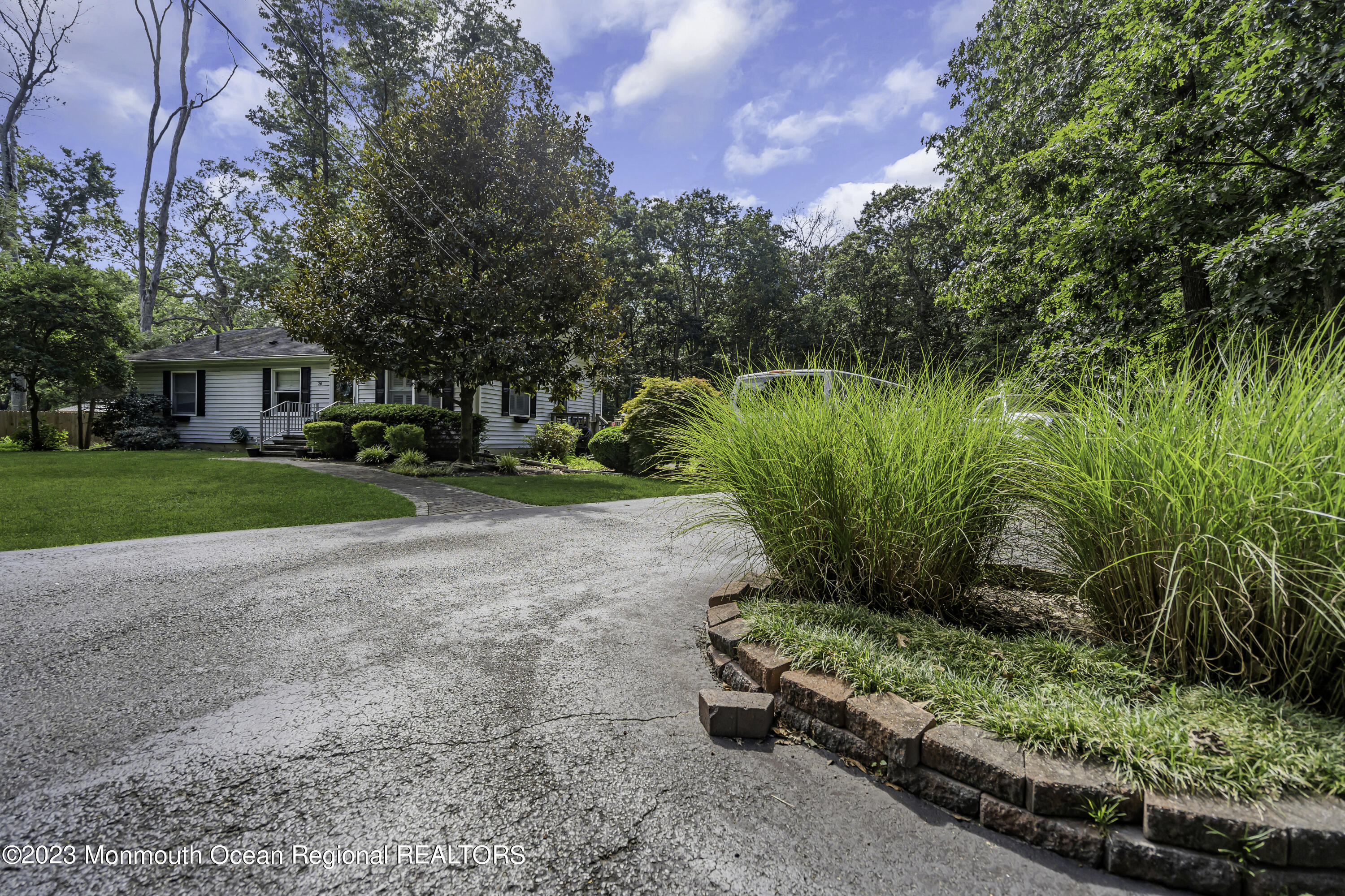 26 Frank Applegate Road Jackson, NJ 08527 - Photo 3 of 16 a view of a garden with a fountain