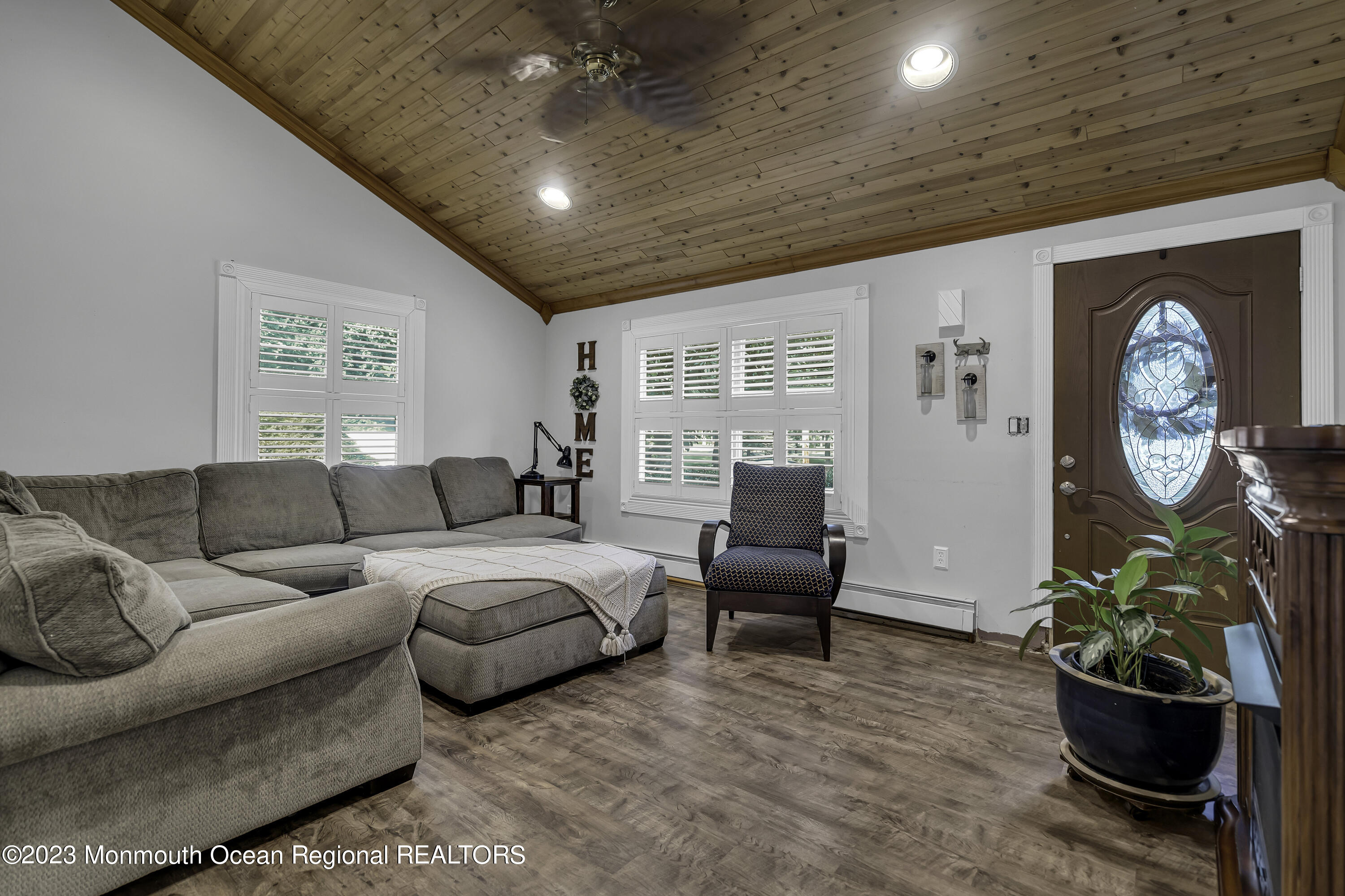 26 Frank Applegate Road Jackson, NJ 08527 - Photo 4 of 16 a living room with furniture a clock and a window