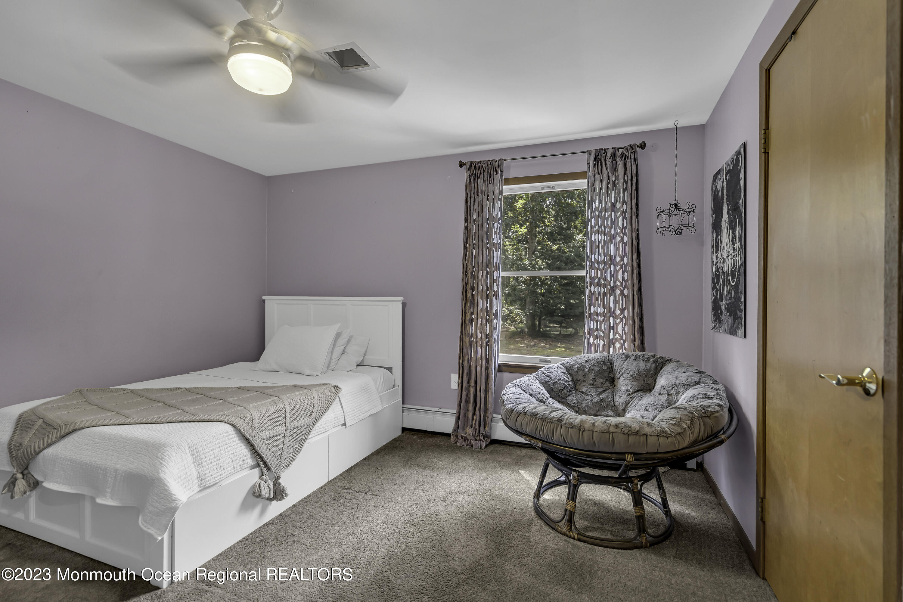 26 Frank Applegate Road Jackson, NJ 08527 - Photo 8 of 16 a spacious bedroom with a bed and a chandelier
